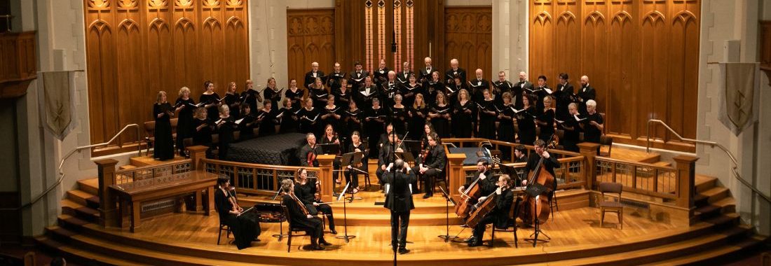 Seattle Choral Company singers in concert at Seattle First Baptist with small chamber orchestra